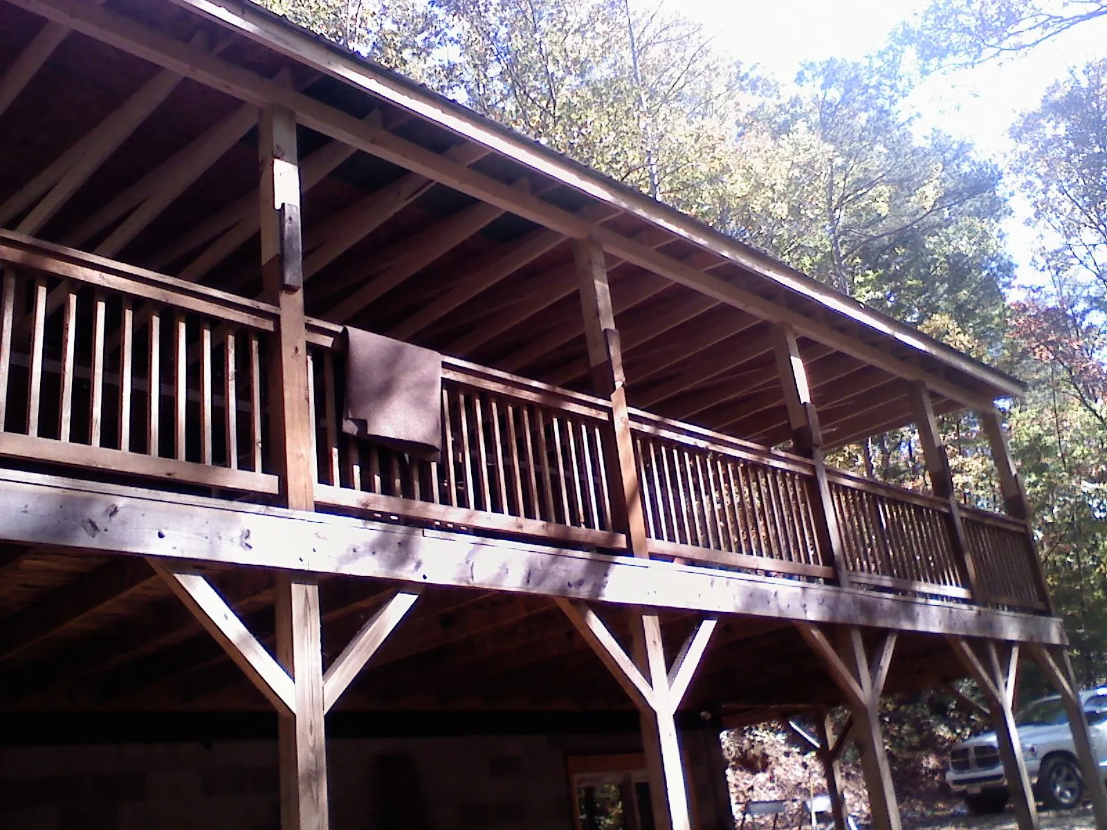 Timber framing under a new elevated porch and deck — Roof Leak Repair in New Suffolk by Roofing Brothers